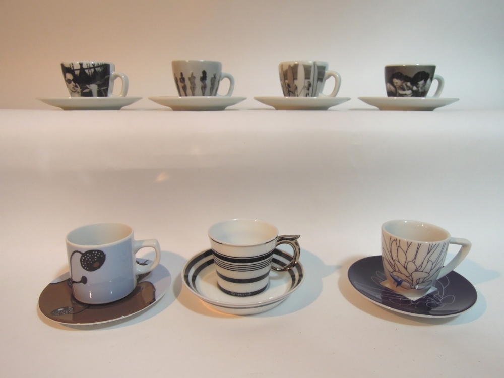 An extensive collection of Nespresso cups and matching saucers in various designs by various