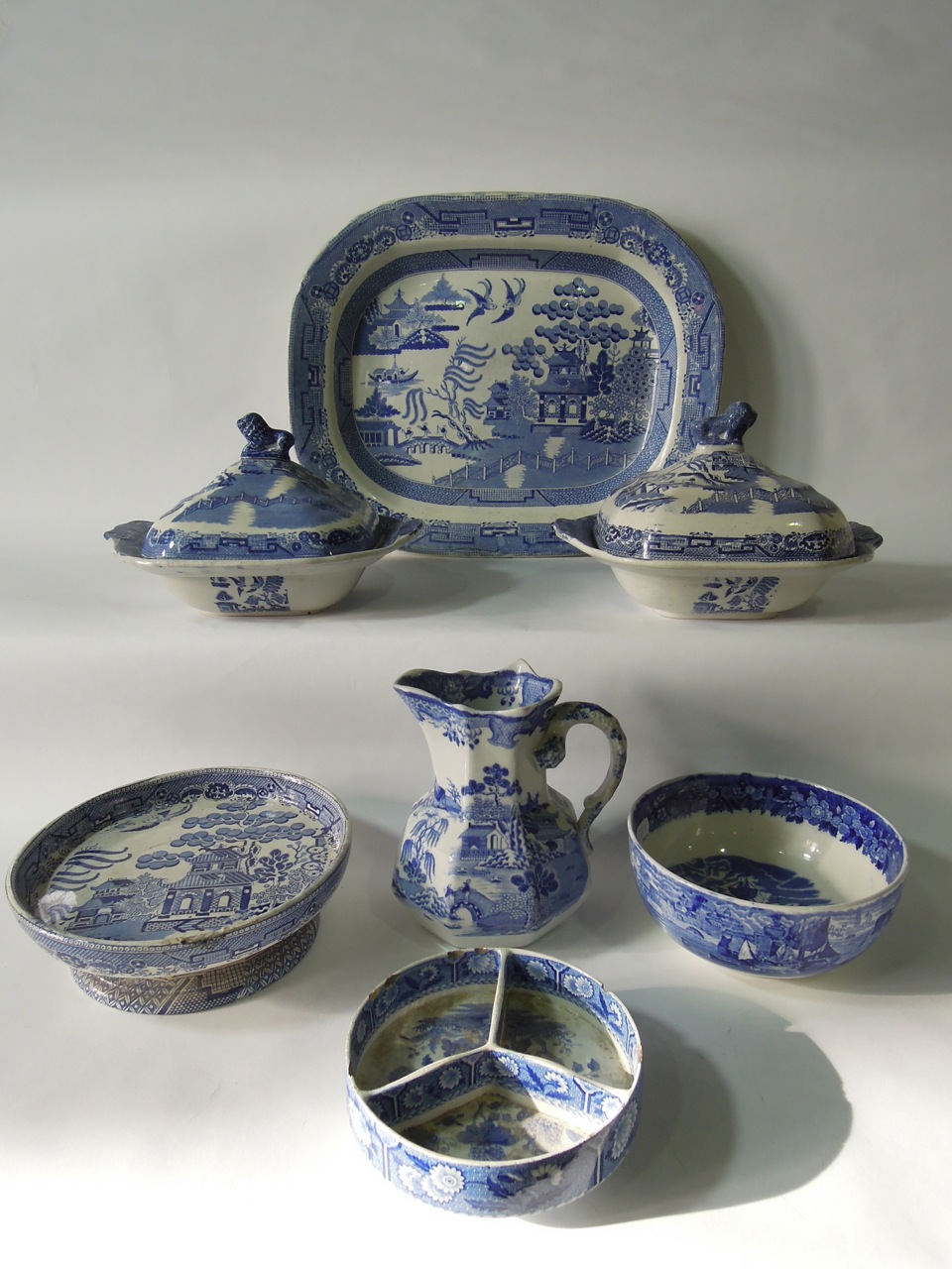 A selection of 19th century and later transfer printed blue and white dinner wares including a "