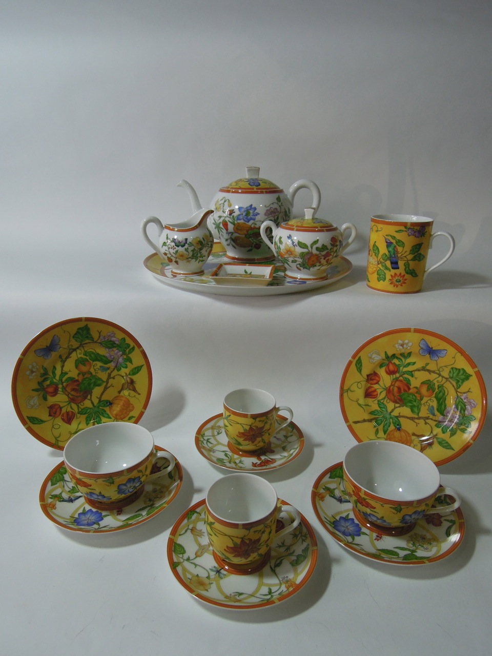 A quantity of Hermes "La Siesta" tea wares with floral decoration on a yellow and white ground