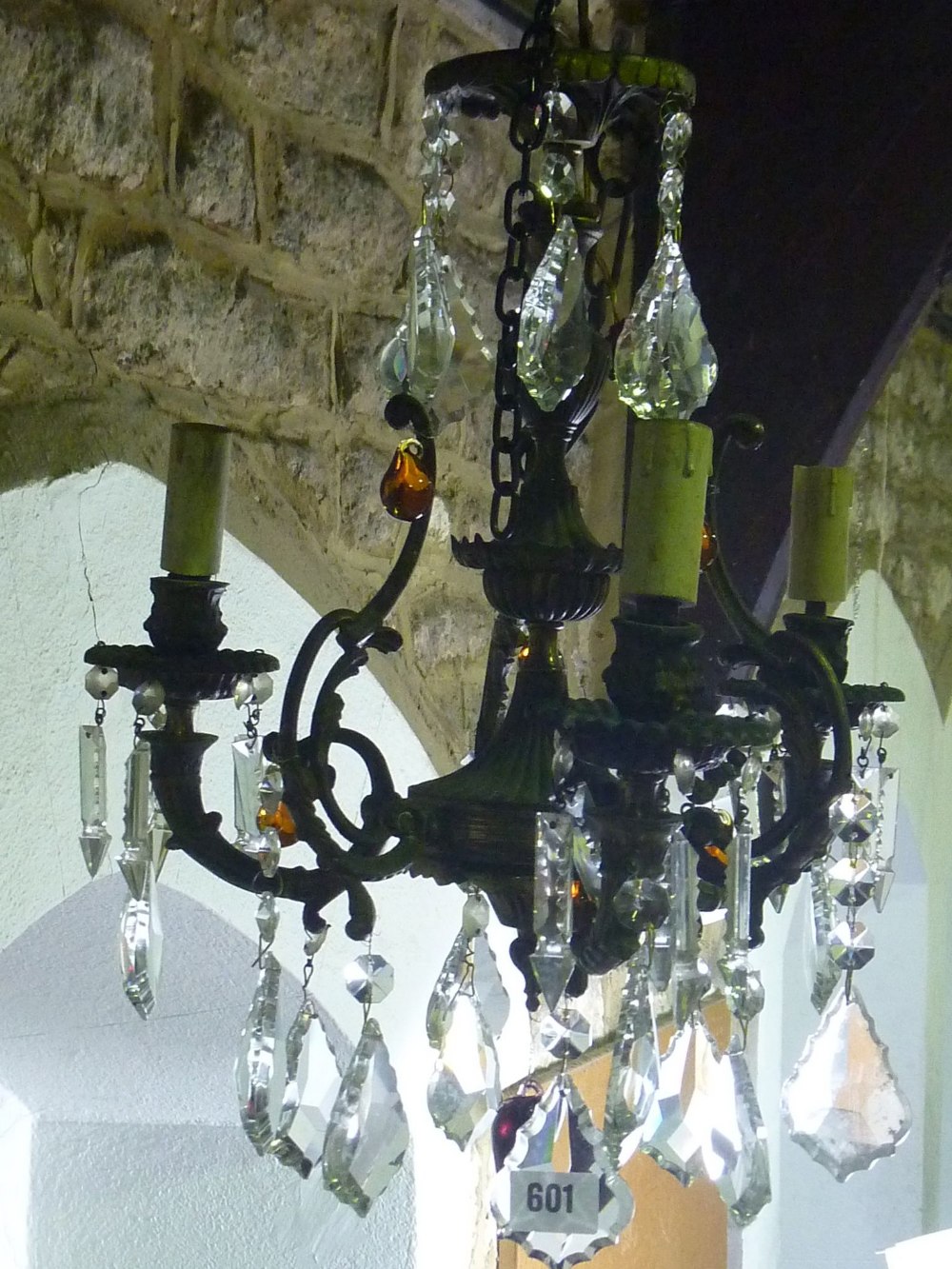 A small 6-branch brass effect chandelier with cut glass prism drops