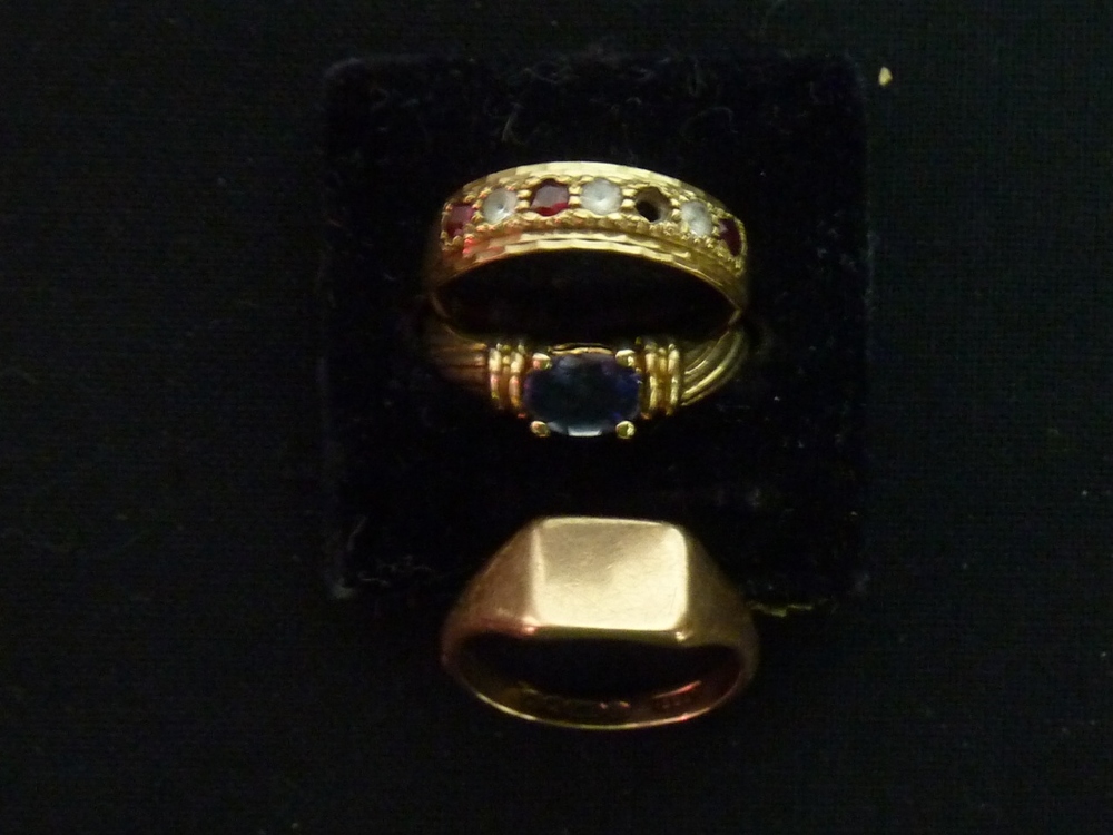 A 9ct gold signet ring and two further stone set 9ct rings