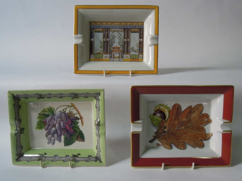 A selection of ashtrays including a Hermes Paris brown and white ashtray decorated with a conker and