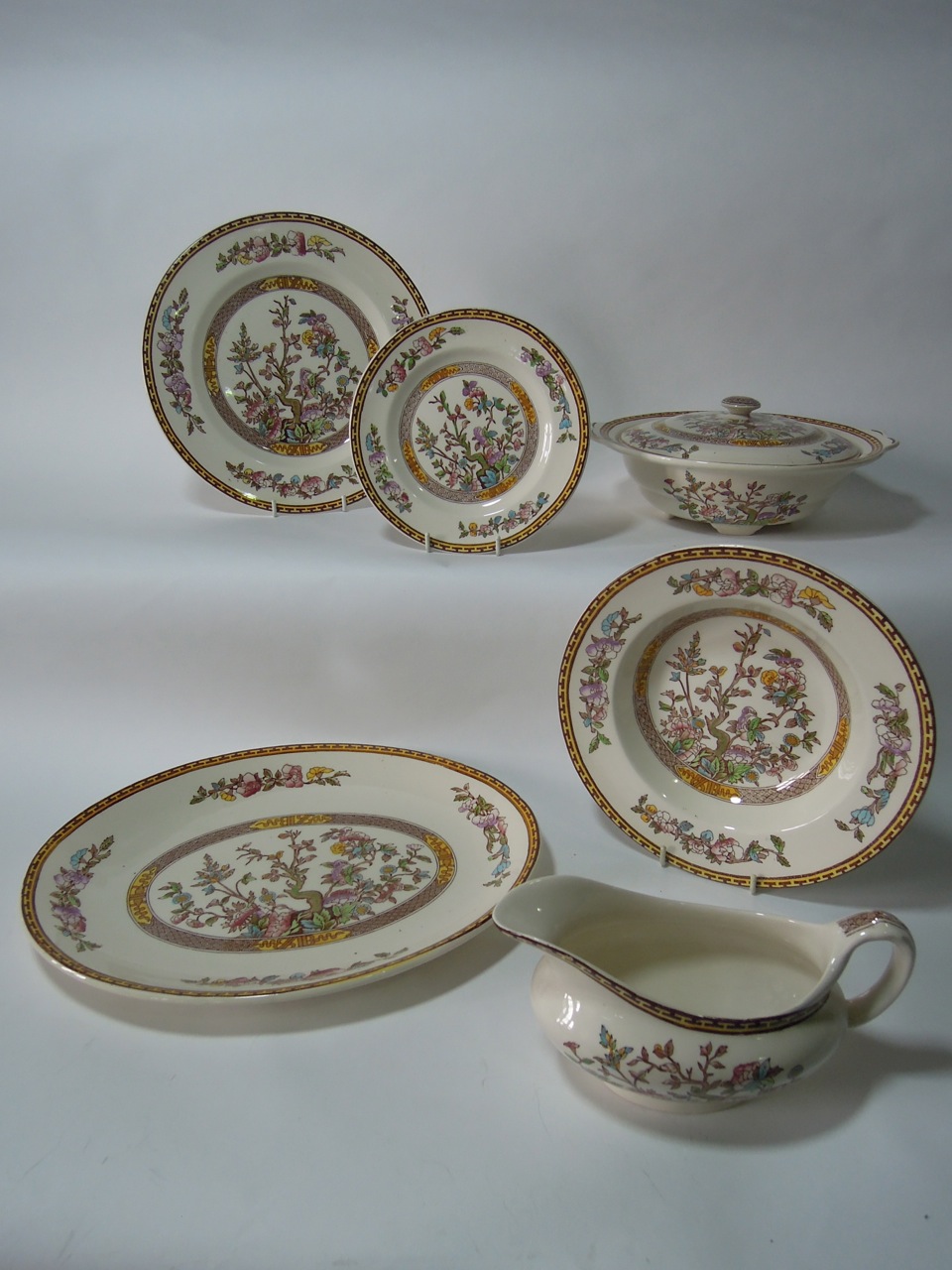 A quantity of Washington Indian Tree dinner wares comprising two lidded tureens, platter, sauce