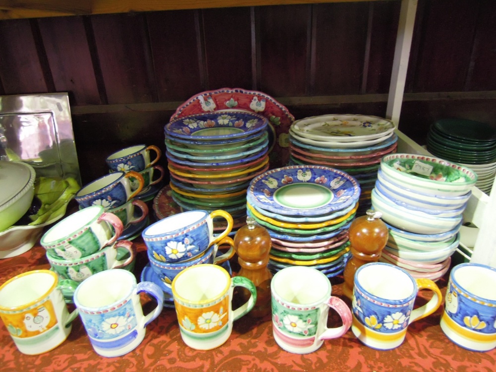 An extensive quantity of handmade Italian ceramic dinner and coffee wares in various colours with