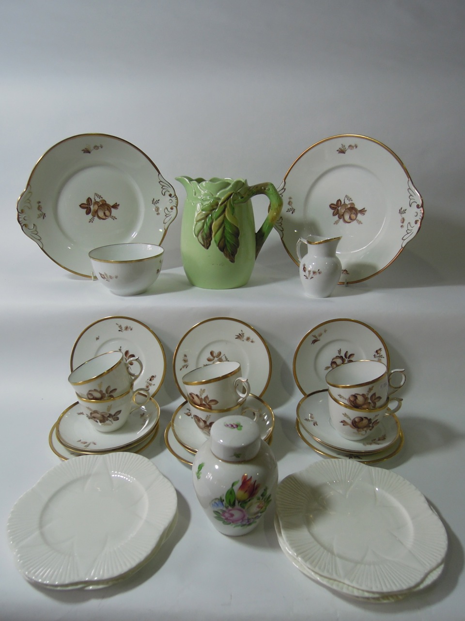 A part Royal Copenhagen tea set 688-9070 decorated with brown floral sprays and gilded rims