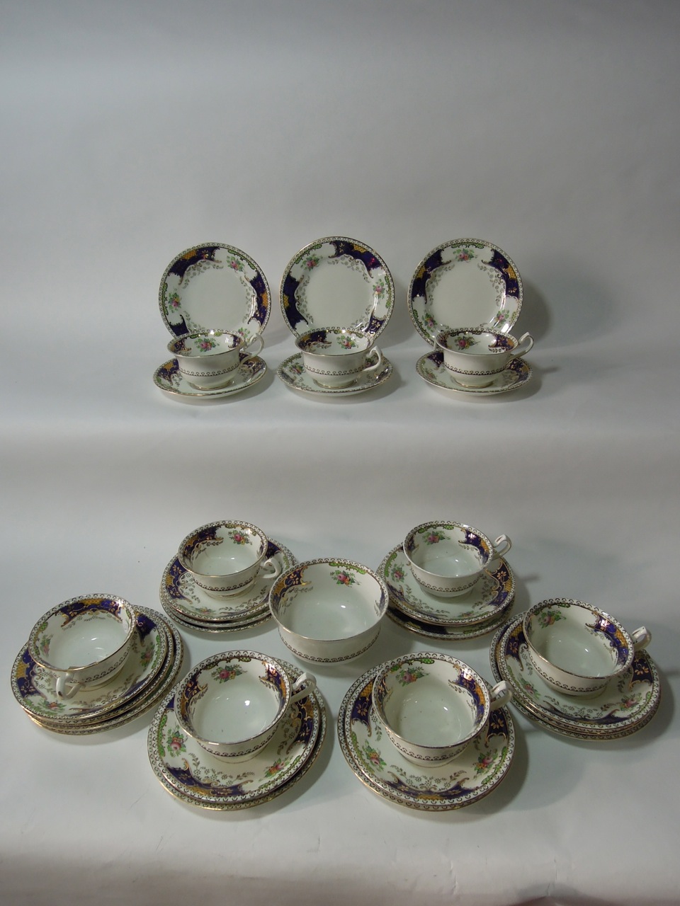 A Fenton "Kenmare" pattern tea set including nine trios and a sugar bowl