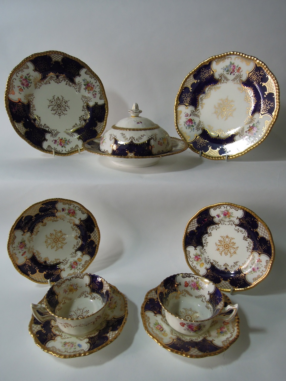 A large collection of Coalport batwing tea wares circa 1900 with gadrooned borders decorated