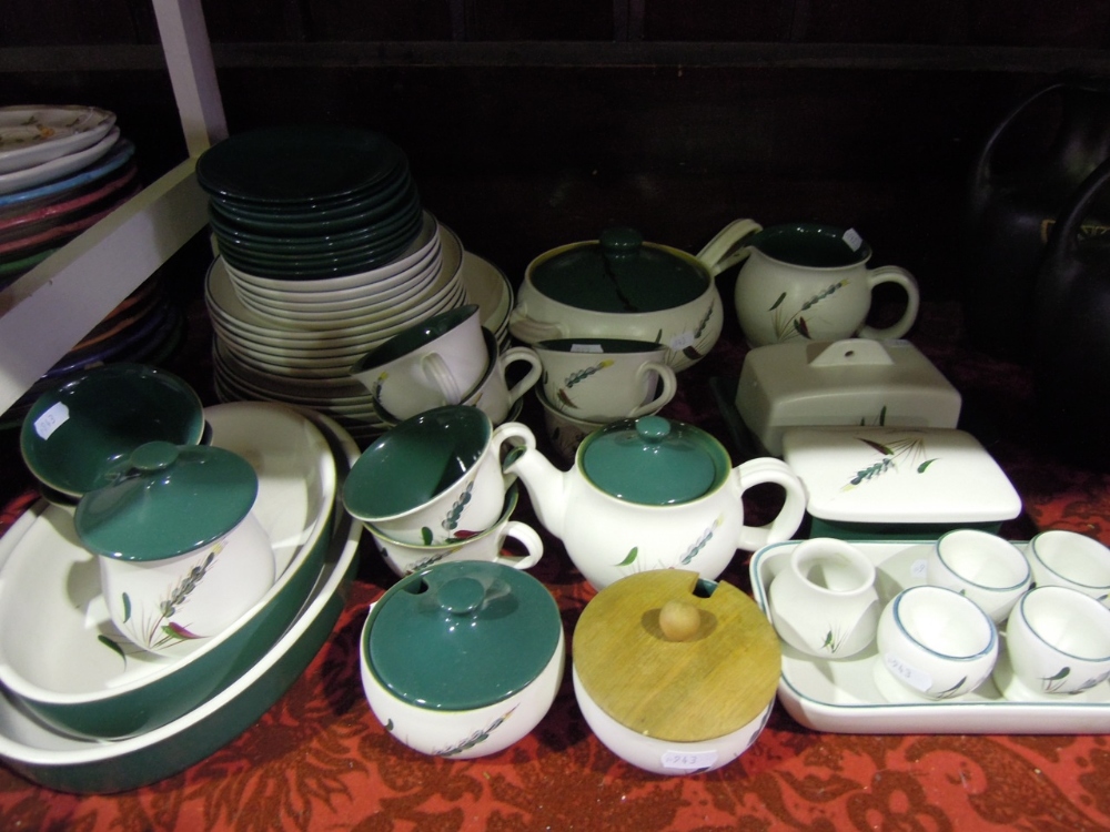 An extensive collection of Denby "Greenwheat" dinner wares comprising seventeen plates (various