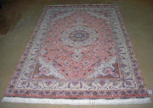 A TABRIZ PART SILK CARPET,PERSIA, MODERN the rose field with an ivory floral star medallion, similar