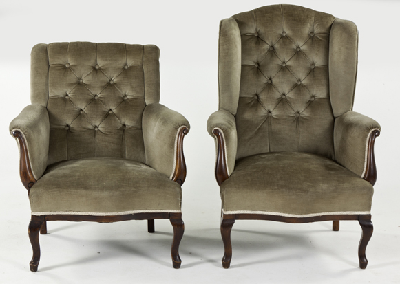 A VICTORIAN MAHOGANY AND UPHOLSTERED WINGBACK ARMCHAIR the padded button-back above a stuff-over