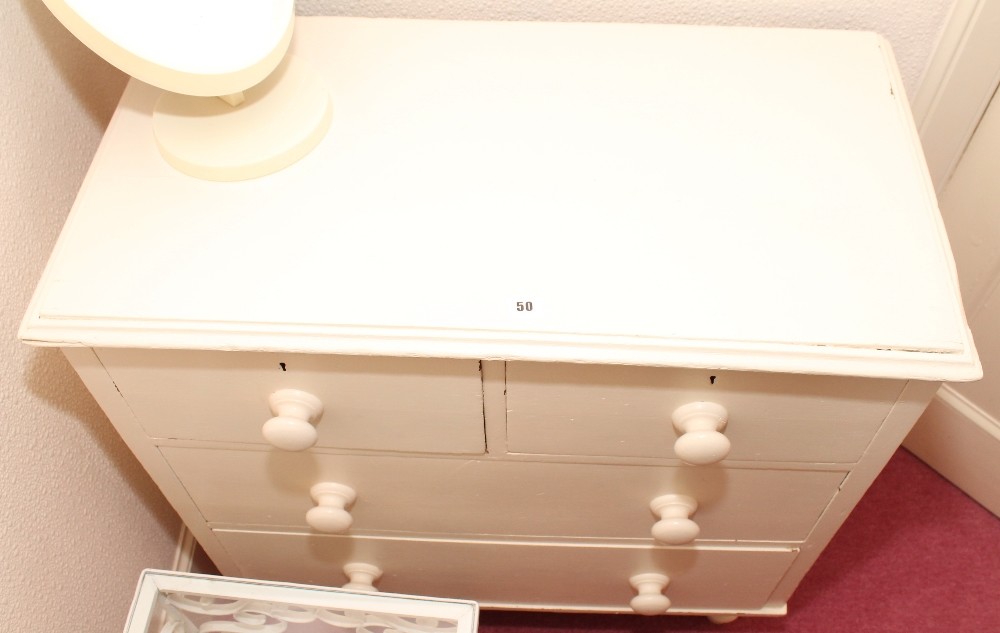 Victorian white painted chest of two short and two long drawers.