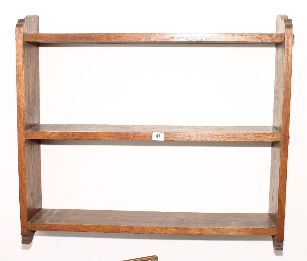 Oak three-shelf wall mounted book rack.