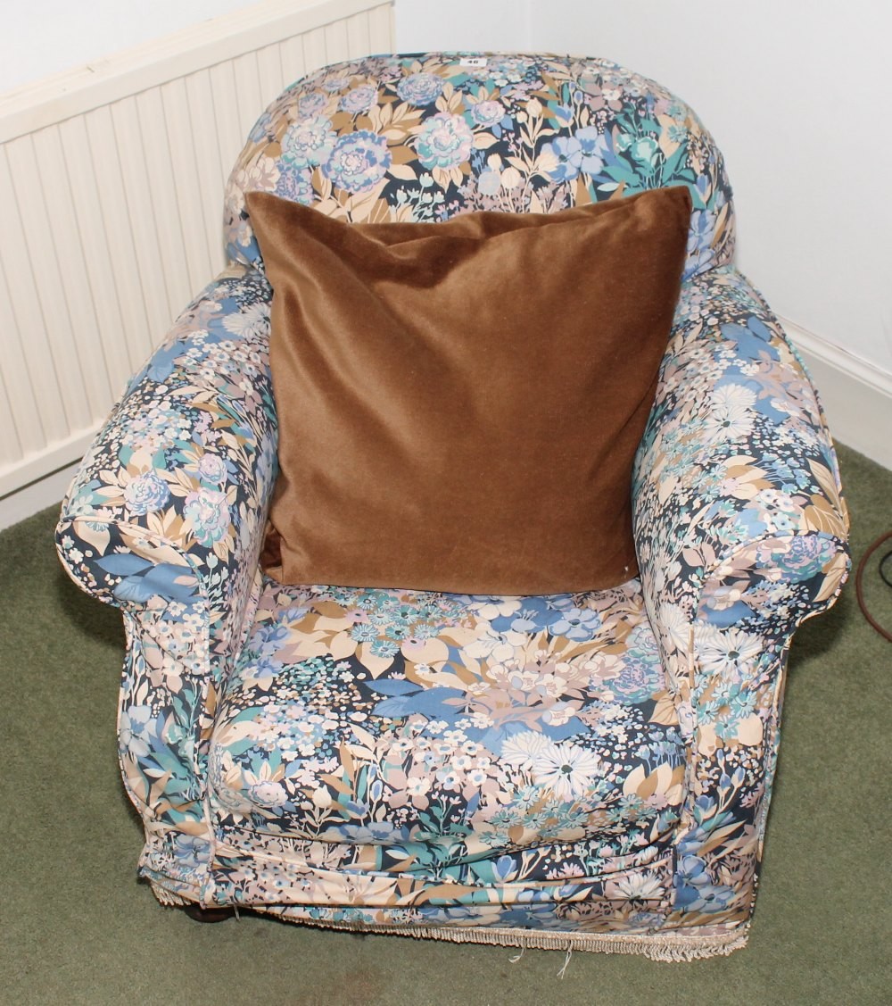 Edwardian floral upholstered armchair.