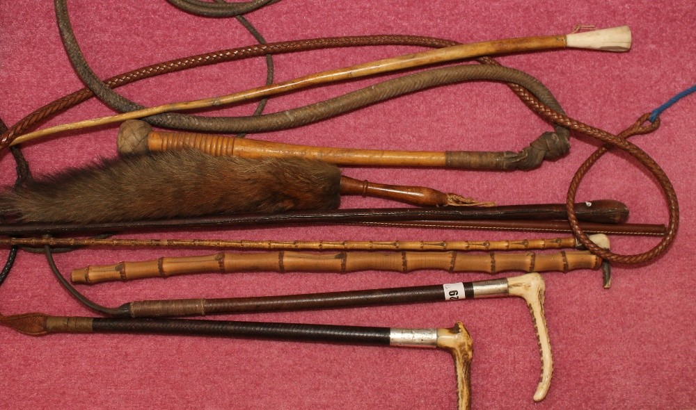 Two bone-handled silver-mounted riding crops and seven others.  (9)
