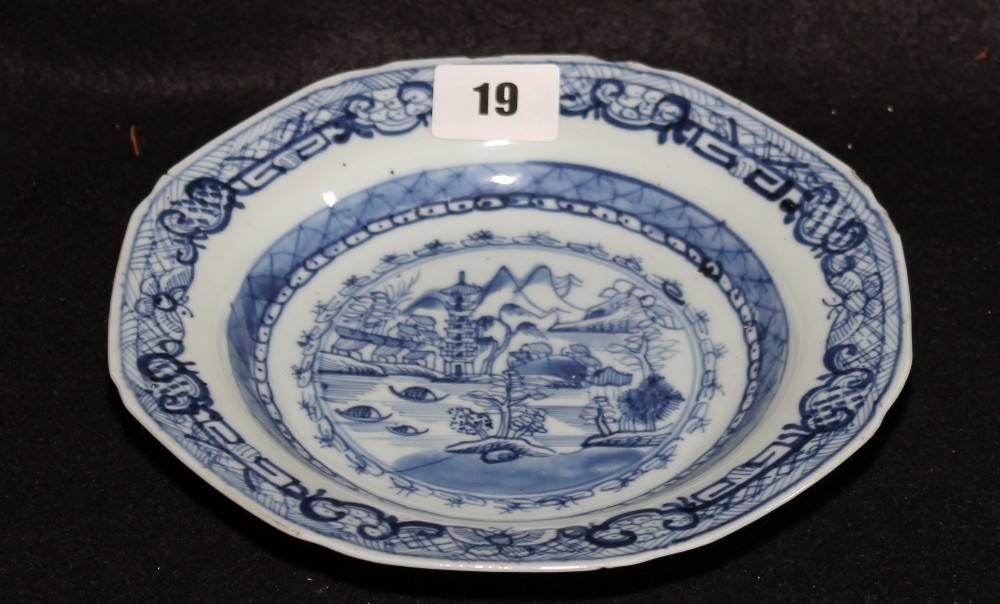 Early 19th century tin glaze dish of shaped hexagonal form depicting an oriental garden scene,