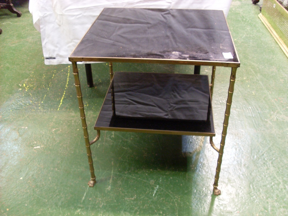 Gilt metal two-tier glass lamp table.