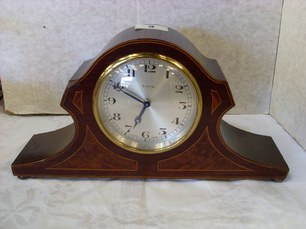 Mahogany mantel clock with circular silvered dial, 12in wide.