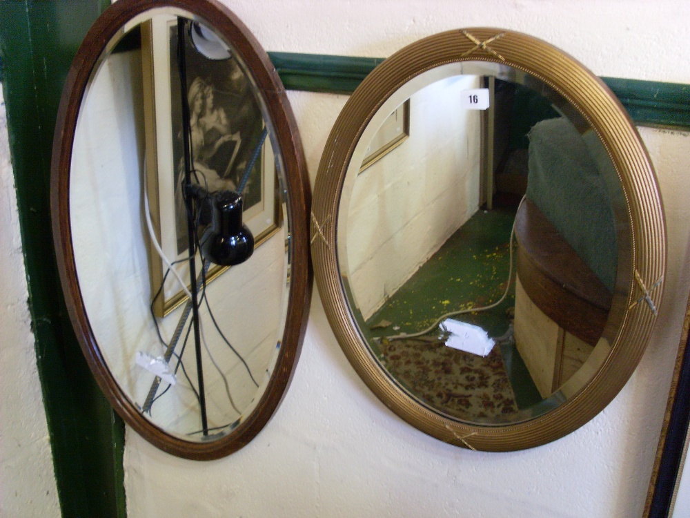 Oval gilt mirror and another.