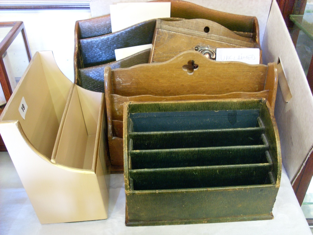 Five various stationery racks.