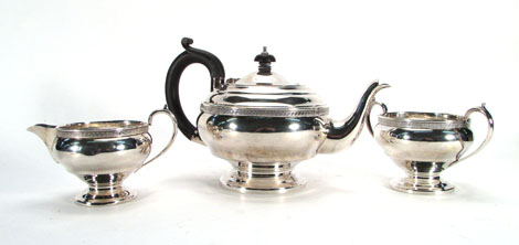 A silver three piece tea set, the vase shaped bodies with key pattern borders, maker HJAB,