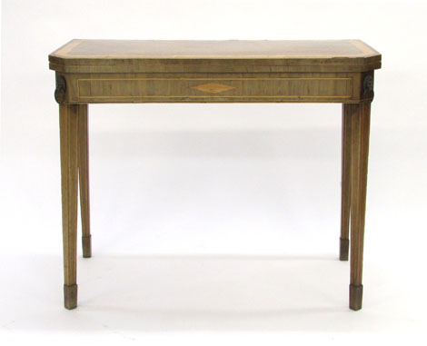 A George III mahogany, crossbanded and strung card table, the rectangular top with canted corners on