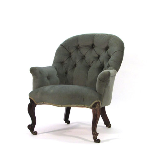 A Victorian button upholstered fireside chair on cabriole legs CONDITION REPORT: structurally a