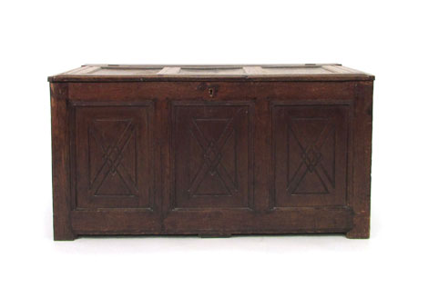 A 17th century and later panelled oak coffer with carved decoration, w. 125 cm  CONDITION REPORT: