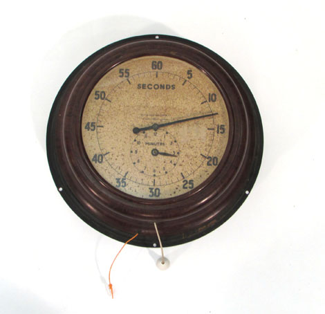 A wall clock by Smiths, the dial with separate minute and second registers in a circular Bakelite