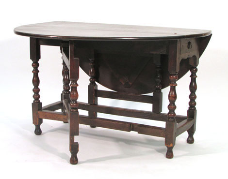 A carved oak occasional table of two tier octagonal form