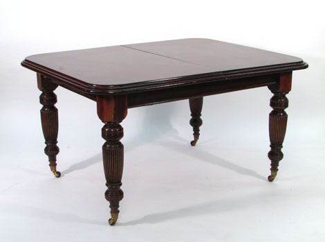 A 19th century and later mahogany extending dining table, the moulded top with rounded corners on