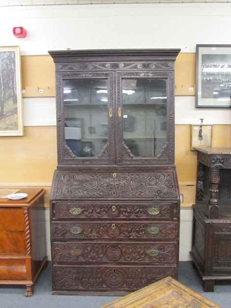 An 18th century and later carved oak bureau bookcase, w. 118 cm CONDITION REPORT: with losses,