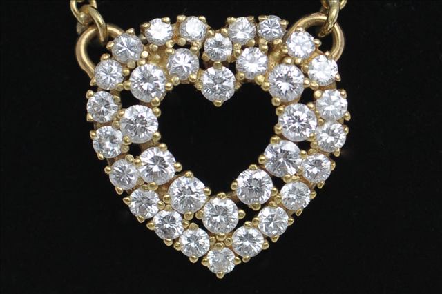 A DIAMOND OPEN HEART SHAPED PENDANT, consisting of a double row of brilliant cut diamonds, thirty