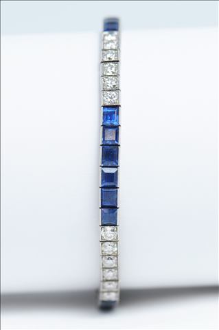 A SAPPHIRE AND DIAMOND FINE QUALITY SINGLE LINE BRACELET, consisting of twenty four brilliant cut