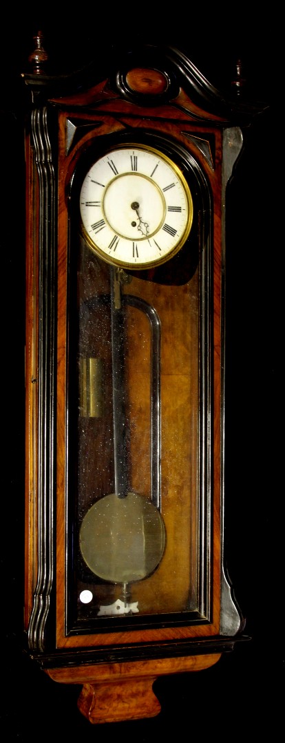 A 19th century ebonised and walnut cased Vienna wall clock with thirty hour movement,  with single