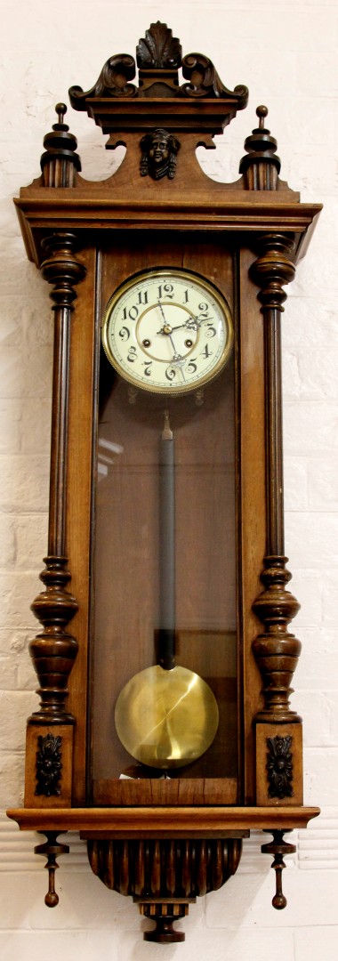 A large late 19th century Vienna wall clock, with circular Arabic dial and traditional case, with