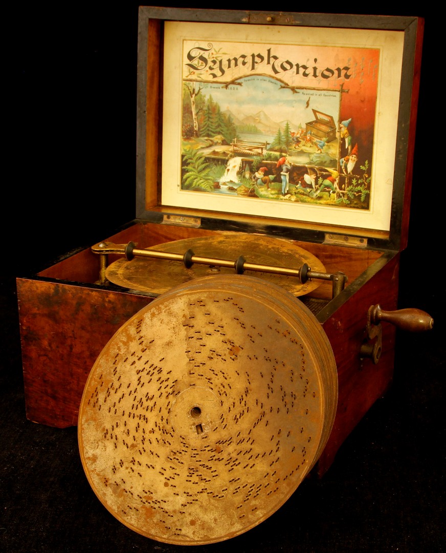 A 19th century walnut cased Symphonion wind up music player, the inner lid marked 'Brevete S.G.D.