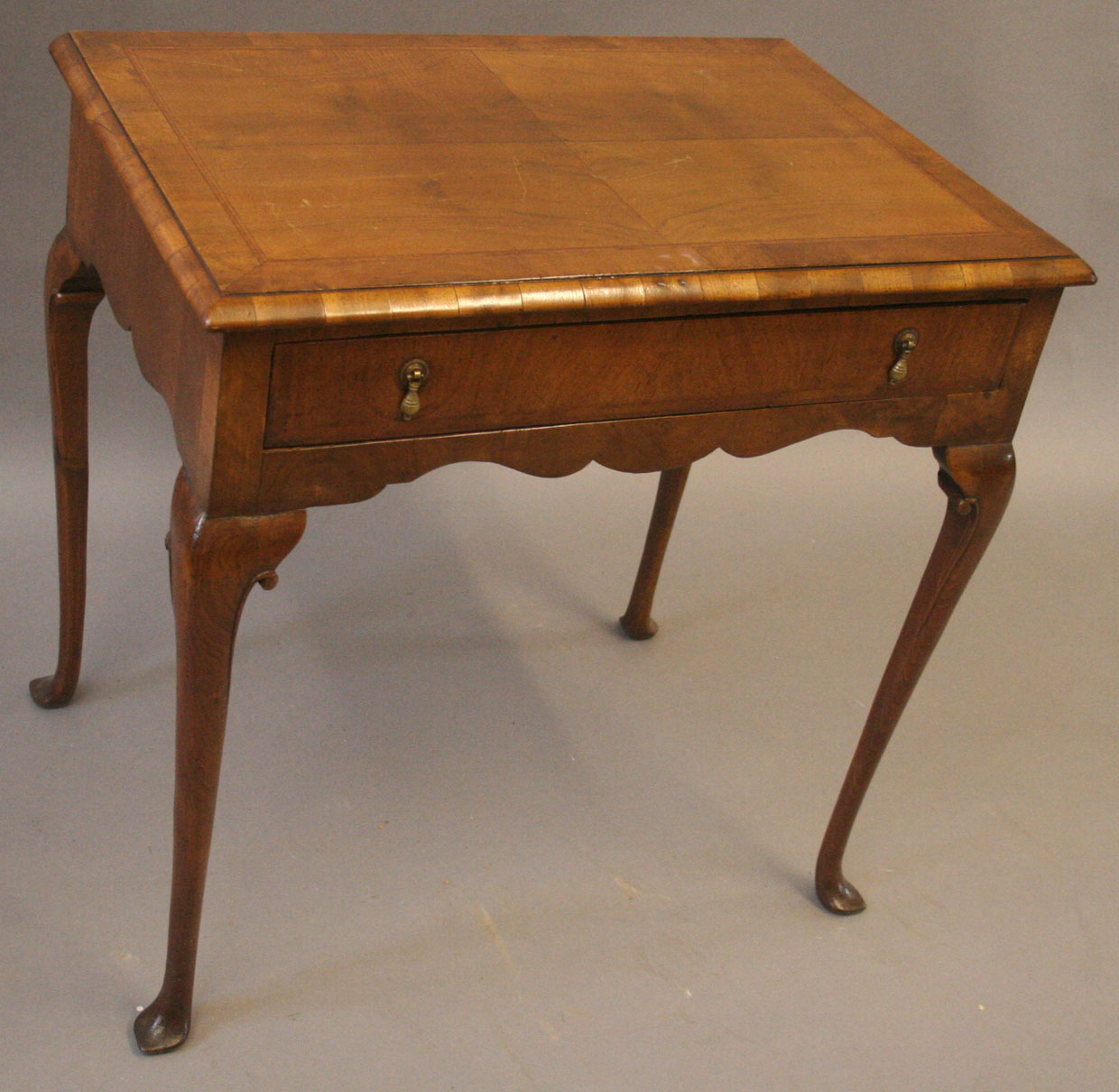 A good quality Charles Tozer early Georgian style walnut side table, the quarter veneered top with