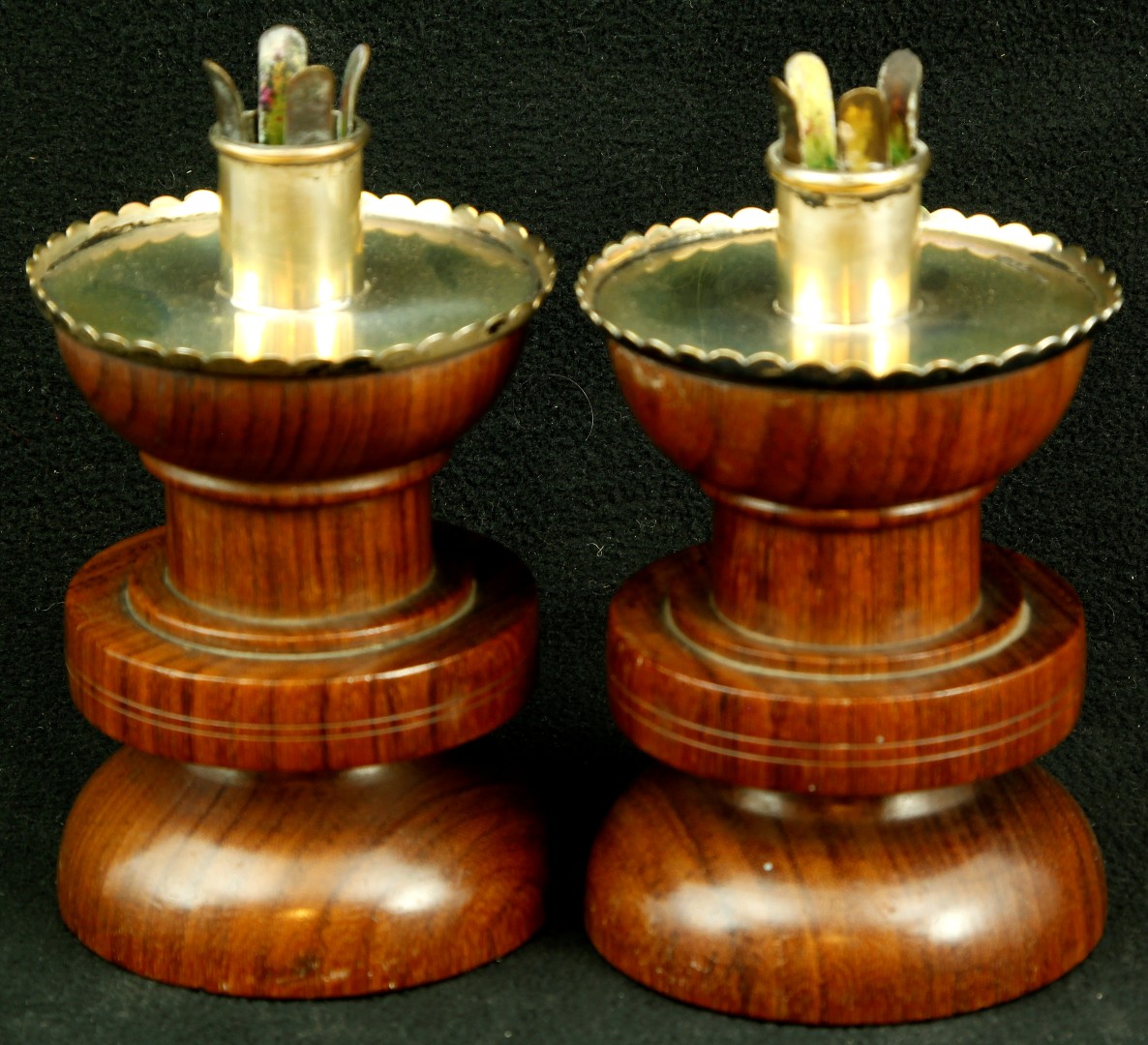 A pair of Edward VII hallmarked silver mounted and hard wood candle holders of cylindrical form,