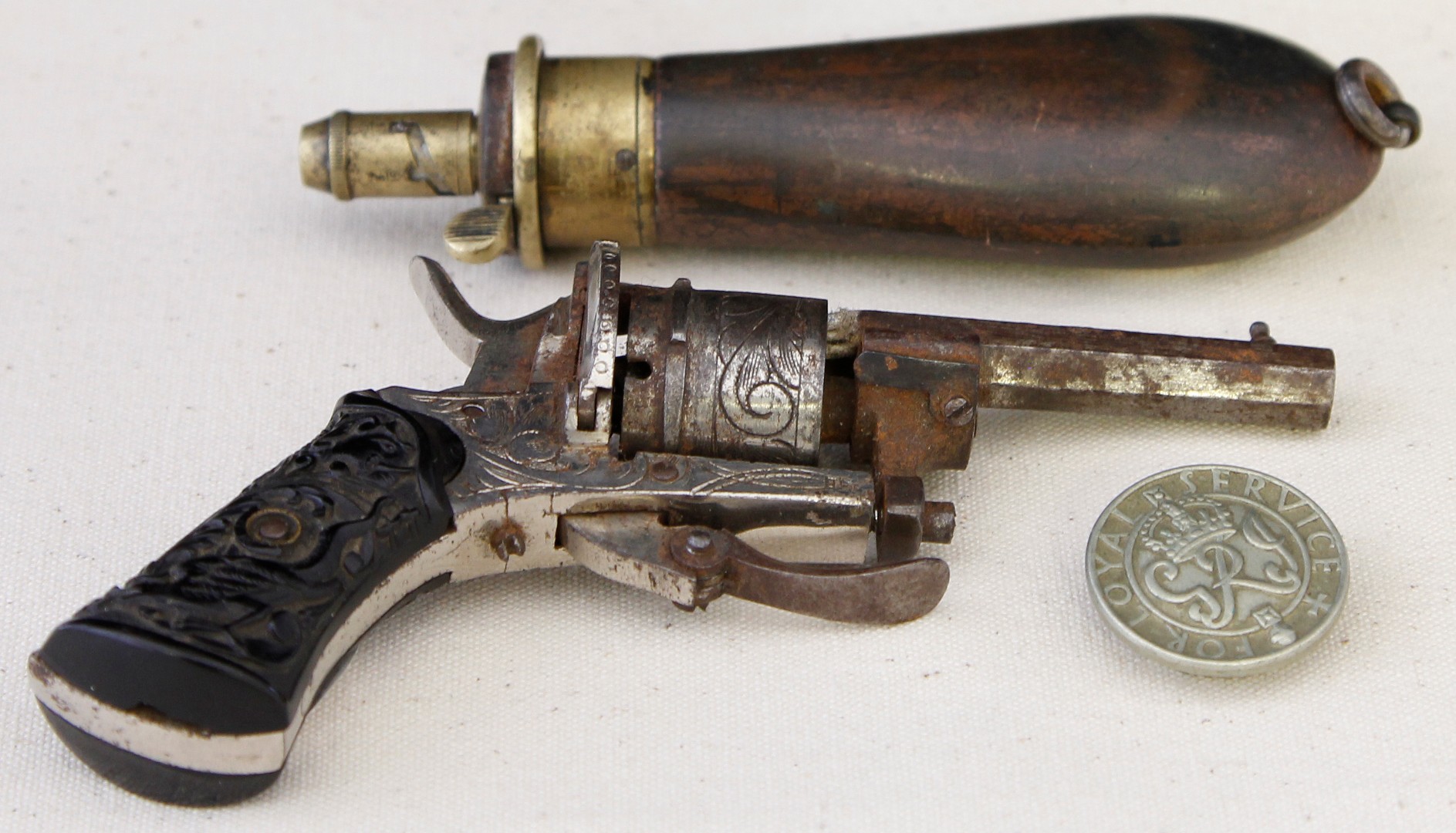 A late 19th century six shot 22 calibre pin fire revolver, length of barrel 5cm, the whole with