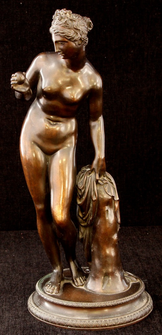 A 19th century bronze figure of the Roman goddess Venus, depicted nude, standing with her weight