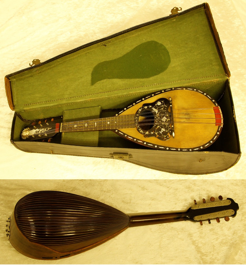 An Italian bow back mandolin by Luigi Ruocco, with applied tortoiseshell and mother of pearl