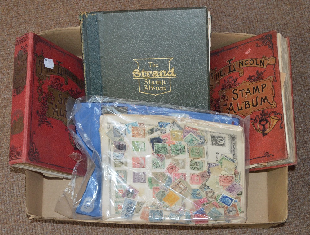 A mixed lot of stamps to include old time worldwide ranges in two "Lincoln" and a "Strand" album,