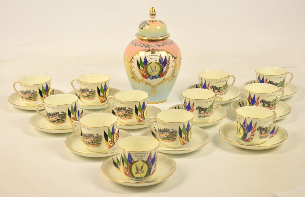 Twelve Aynsley "Peace 1919" cups and saucers with a matching oval jar and cover.   CONDITION REPORT: