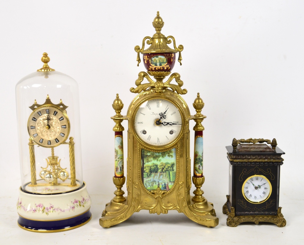 A modern decorative three piece clock garniture with transfer decoration, a modern French black