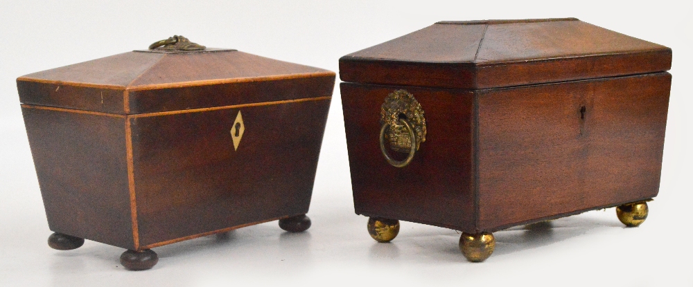 An early 19th century mahogany two division tea canister with rosewood veneered interior lids and