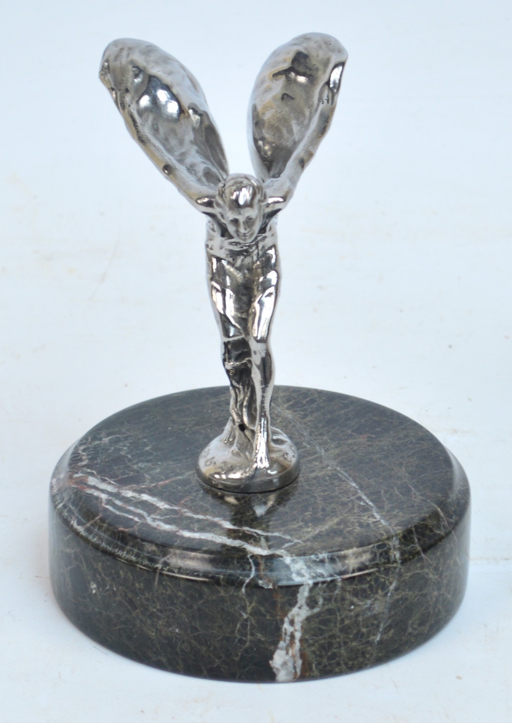 After CHARLES SYKES; a chrome car mascot for Rolls Royce "The Spirit of Ecstasy", the reverse of the