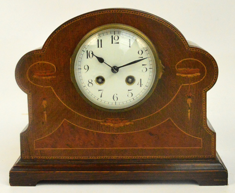 An early 20th century oak inlaid eight day dome top mantel clock with circular white enamel dial set
