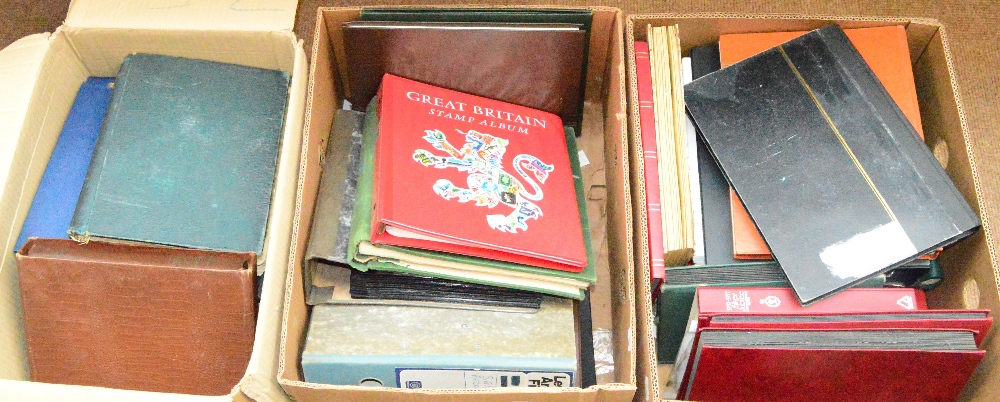Three boxes containing a large quantity of stamps and first day covers.