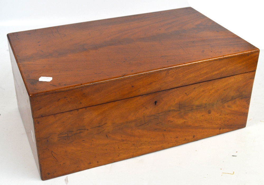 An early Victorian mahogany writing slope, the hinged lid opening a gilt tooled interior with pen