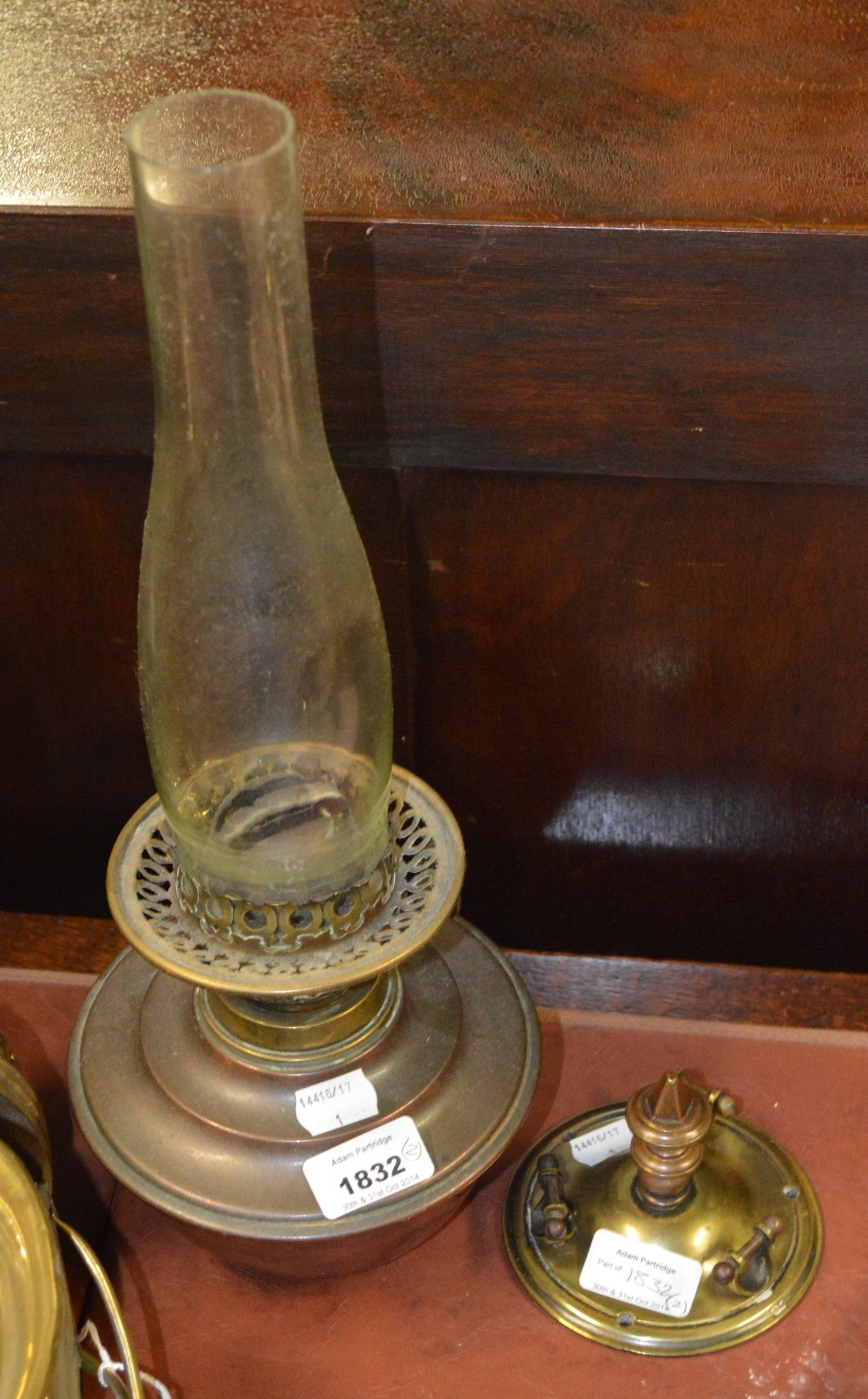 An early 20th century copper ceiling oil lamp with brass mounts.